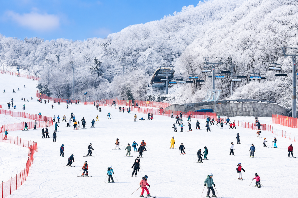 Skiers enjoying a snowy ski resort in Korea during winter
